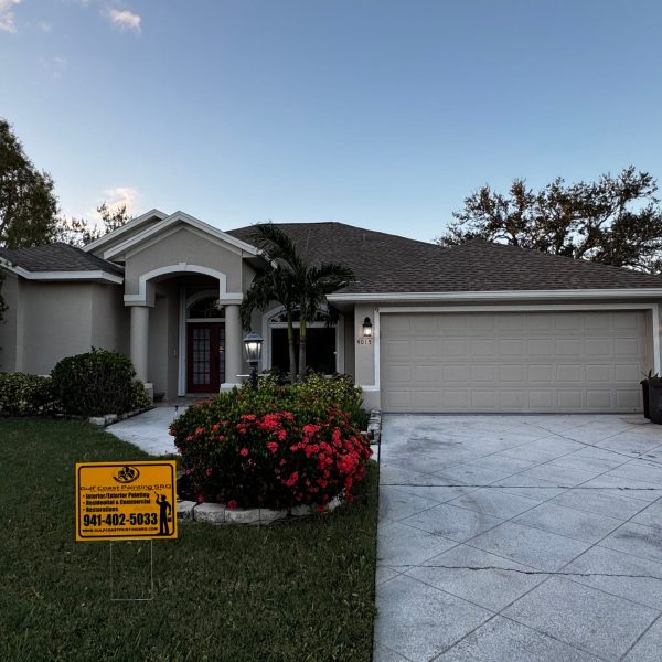 Freshly painted home in Sarasota with a clean, vibrant exterior finish. The house features a smooth, modern paint job using high-quality Sherwin-Williams paint, showcasing crisp edges and a sleek, professional look under the bright Florida sun.