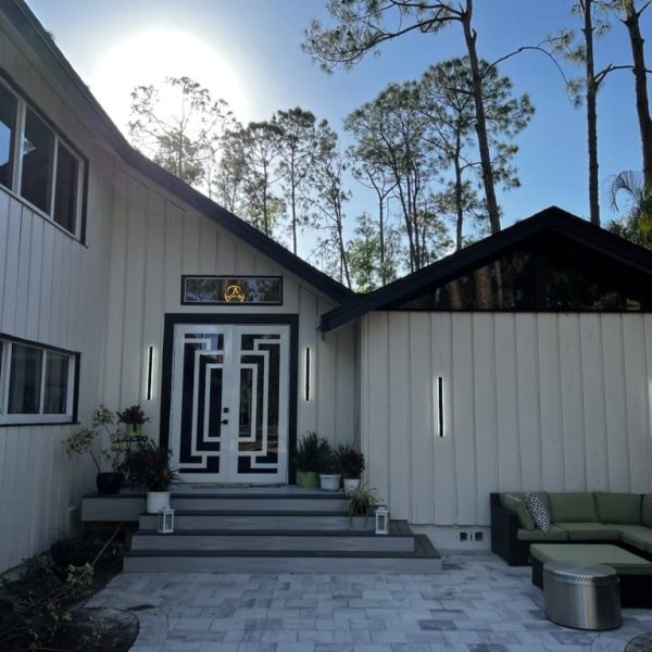 Before and after exterior painting transformation by Gulf Coast Painting SRQ – showcasing a home with fresh white paint and updated front entrance in Sarasota.