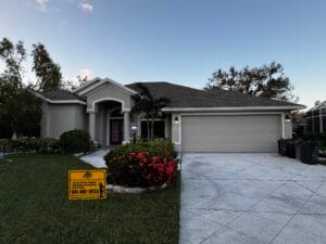 Freshly painted home in Sarasota with a clean, vibrant exterior finish. The house features a smooth, modern paint job using high-quality Sherwin-Williams paint, showcasing crisp edges and a sleek, professional look under the bright Florida sun.