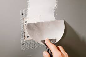 Drywall patch and surface preparation before interior painting in Sarasota